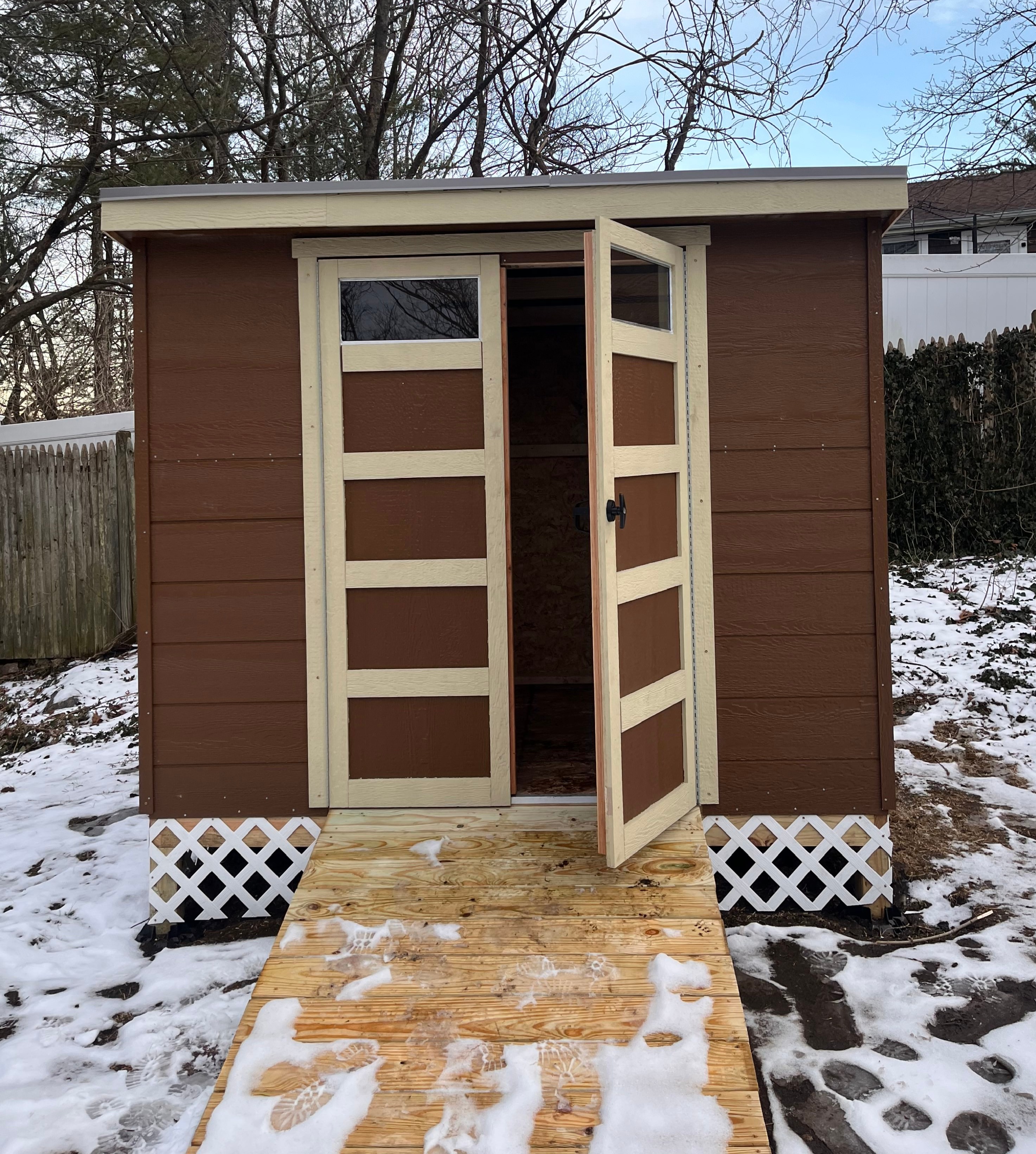 6ft by 8ft  shed with a slanted PVC roof